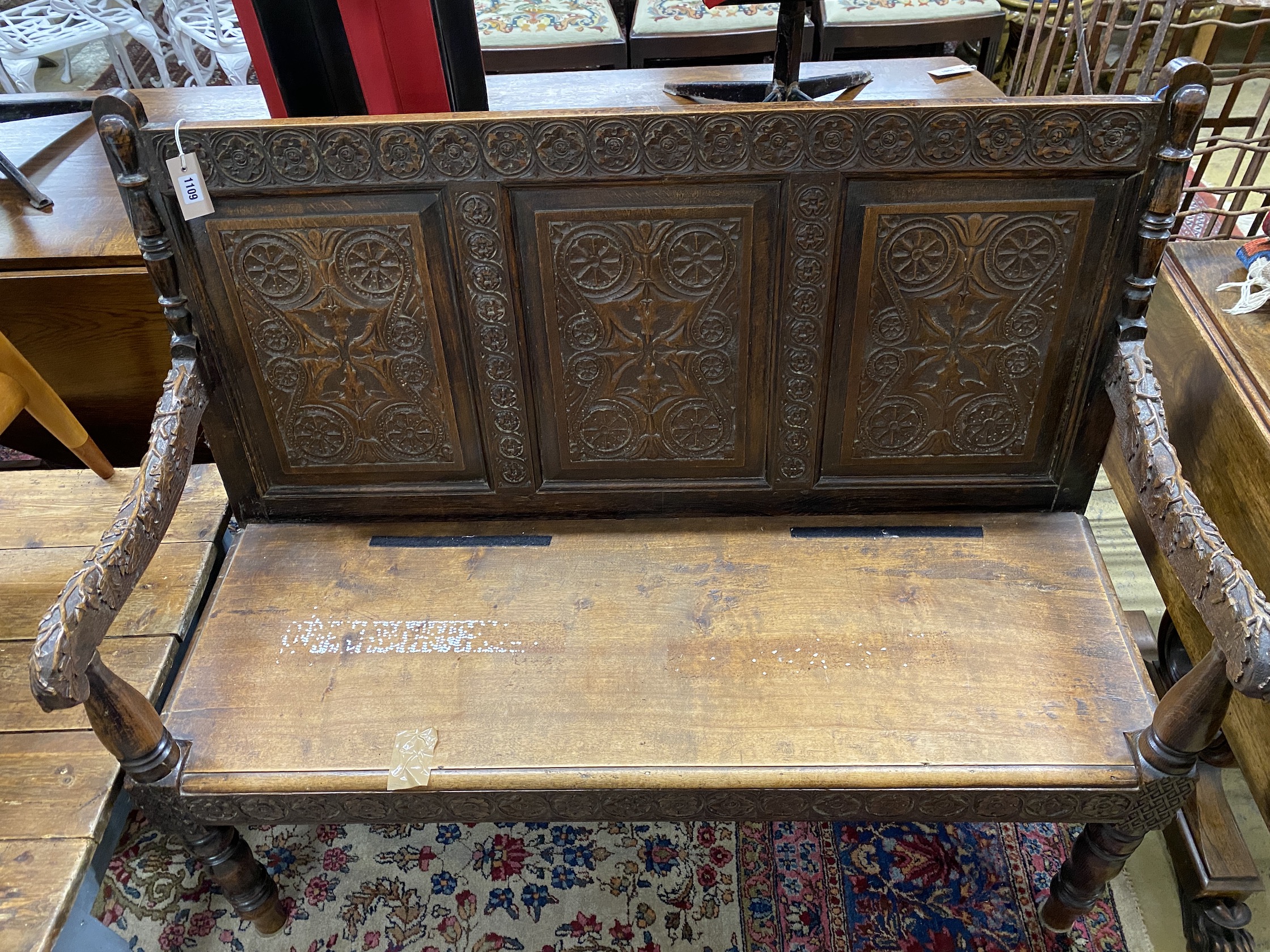 A Victorian carved oak settle, length 122cm, depth 50cm, height 104cm